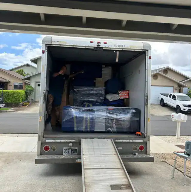 interstate movers ready for move - standing in a moving truck